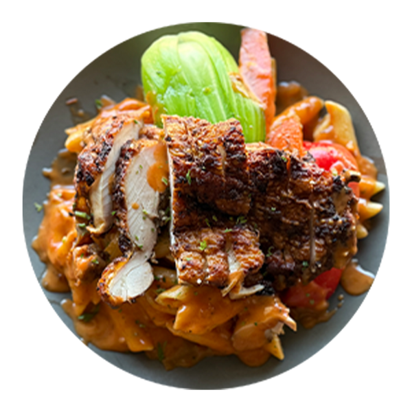 Penne With Coconut Rosé Sauce Topped With Grilled Chicken And Side Market Vegetables