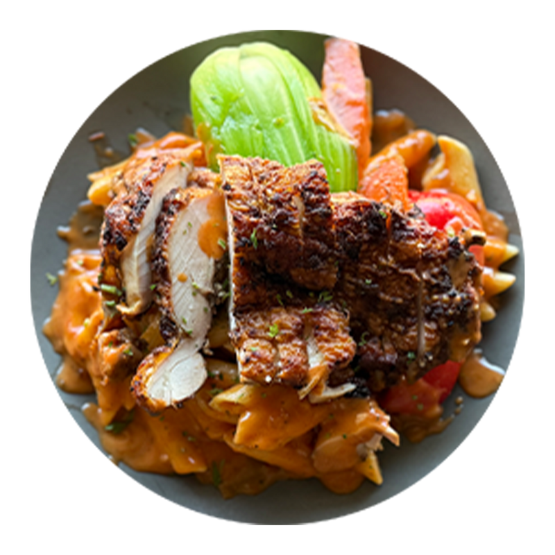 Penne With Coconut Rosé Sauce Topped With Grilled Chicken And Side Market Vegetables